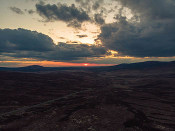 Scenic view of landscape against sky during sunset