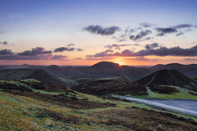 Scenic view of landscape against sky during sunset