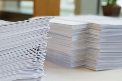 Close-up of paper stack on table