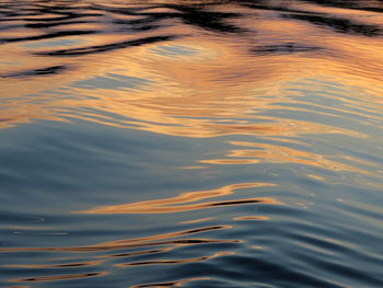 High angle view of rippled water at sunset