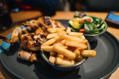 Close-up of fast food in plate on table