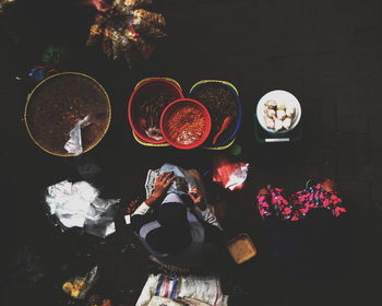 High angle view of people and fish on table