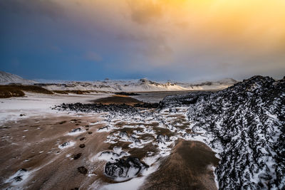 Scenic view of landscape against sky during sunset