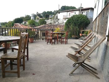 Table and chairs against clear sky