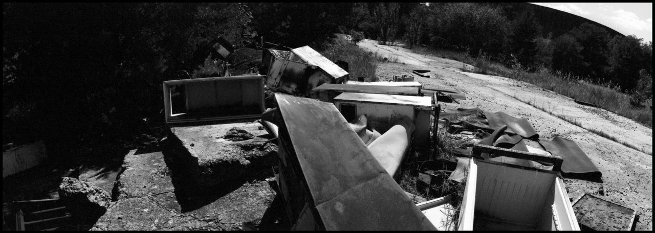 HIGH ANGLE VIEW OF ABANDONED VEHICLE