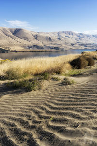 Scenic view of desert against clear sky