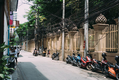 Bicycles on street by buildings in city