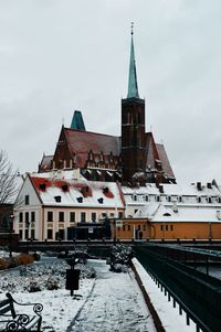 Buildings in city against sky