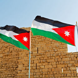 Low angle view of flag against clear sky