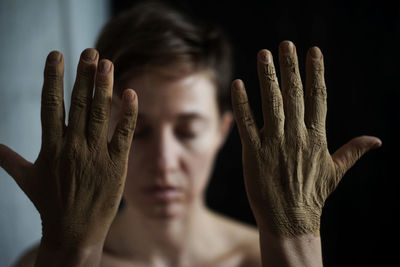 Cropped image of woman against black background 