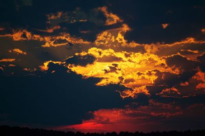 Low angle view of cloudy sky at sunset