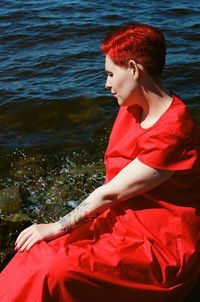 Side view of young woman sitting in boat