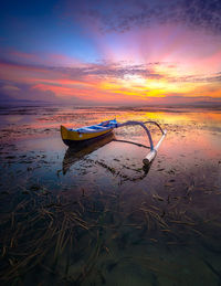 Scenic view of sea against sky during sunrise in sanur bali