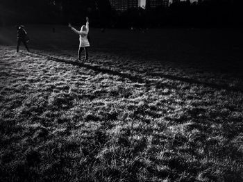 Woman standing by railing