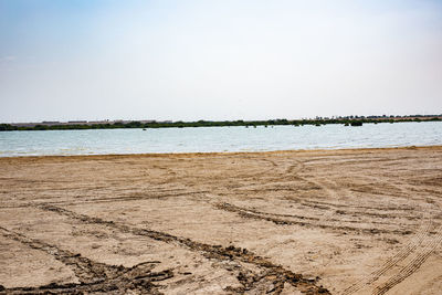 Scenic view of beach against clear sky