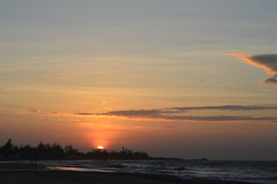 Scenic view of sea against romantic sky at sunset
