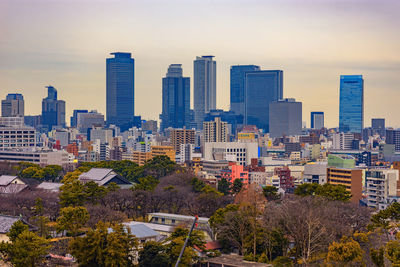 Buildings in city against sky