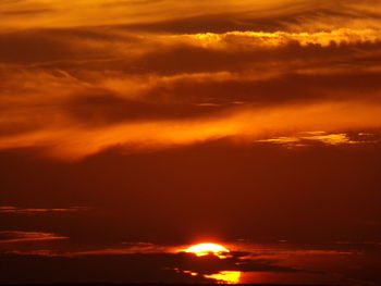 Scenic view of dramatic sky during sunset