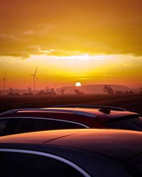 Scenic view of sunset seen through car windshield