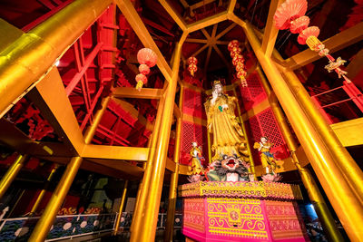 Low angle view of illuminated lanterns outside building