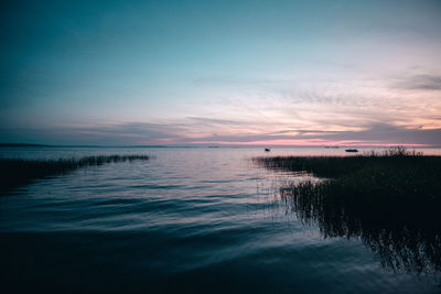 Scenic view of sea against sky at sunset