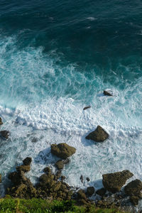 High angle view of rocks in sea