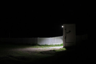 Illuminated street light at night