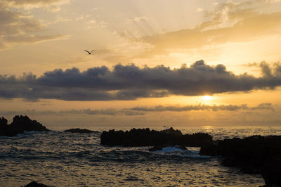 Scenic view of sea against sky during sunset