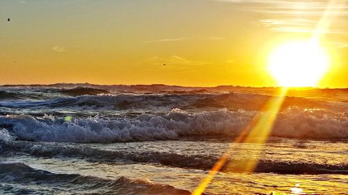 Scenic view of sea against sky during sunset