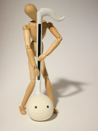 Close-up of toy on table against white background