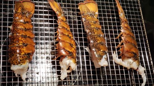 High angle view of meat on barbecue grill