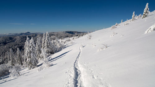 Scenic view of snow covered mountain against sky