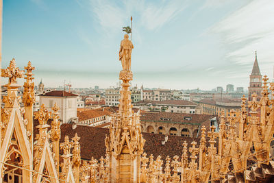 Panoramic view of buildings in city against sky