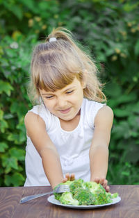 Close-up of cute girl eating food