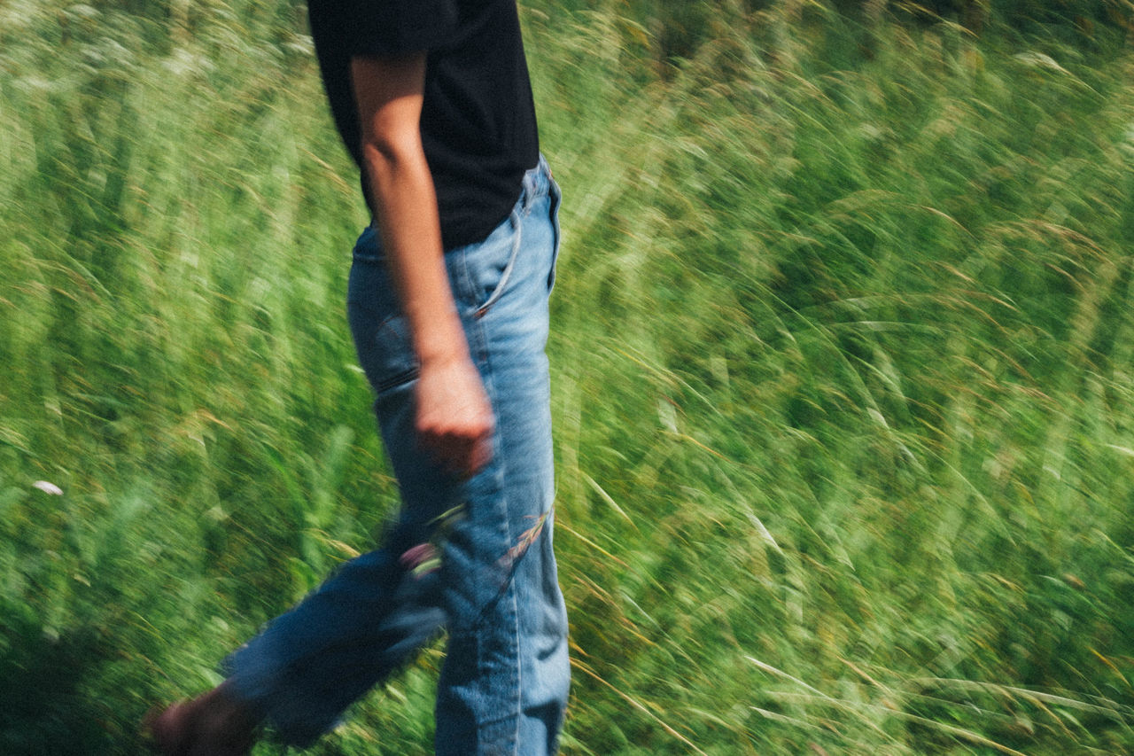 LOW SECTION OF MAN RUNNING ON LAND