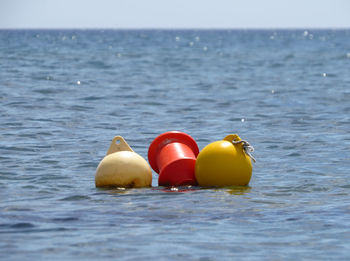 Close-up of buoys in sea