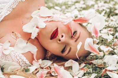 Woman with pink petals