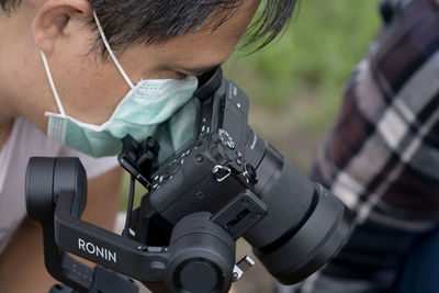 Close-up portrait of man photographing