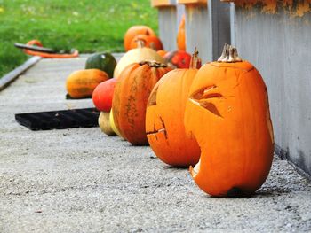 Close-up of pumpkin against orange wall during autumn