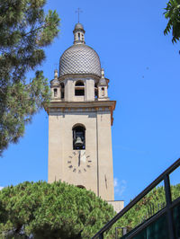 Low angle view of building against blue sky