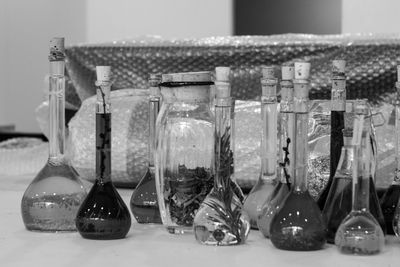 Close-up of glass bottles on table