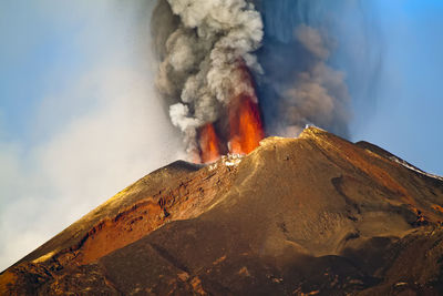 Scenic view of volcanic mountain against sky