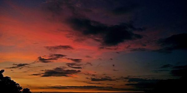 Low angle view of dramatic sky during sunset