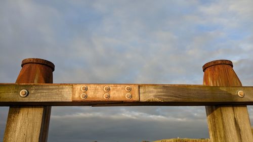 Low angle view of metallic structure against sky