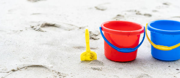 High angle view of multi colored toy on sand