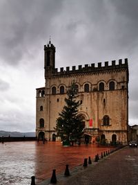 Historic building against cloudy sky