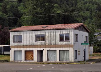 Old building by road in city