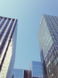 Low angle view of modern buildings against clear sky