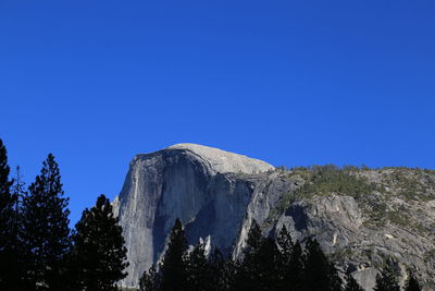 Scenic view of majestic mountains against clear blue sky