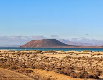 Scenic view of volcanic landscape against sky